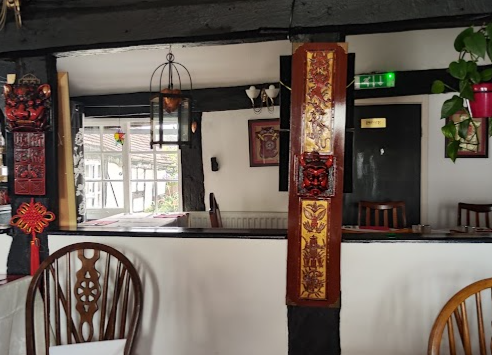 Hand-painted lacquer panels on the original oak beams