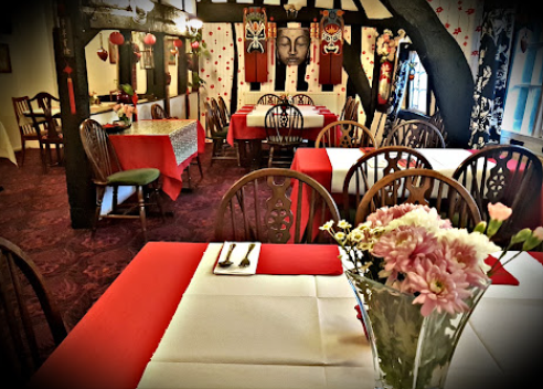 Red and cream laid tables in the Yumi Yumi dining room